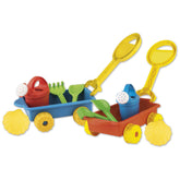 Colorful sand play trolleys with shovels, rakes, watering cans, sieves, and yellow marine molds.