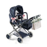 Navy baby stroller with large canopy, pink bows, floral cushion, and attached tote bag, designed for 36-46 cm dolls.