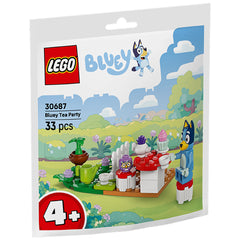 Bluey Tea Party playset featuring Bluey and a Babble-owl figure, vibrant colors, a red mushroom-shaped chair, teapot, cups, and a cupcake on a grassy garden background.