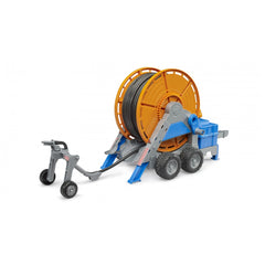 Bruder Irrigation Trailer toy with orange hose reel, gray frame, and blue components on wheels.