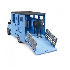 Blue toy animal transporter with a black horse inside, features foldable ramp and detailed design, suitable for imaginative play.