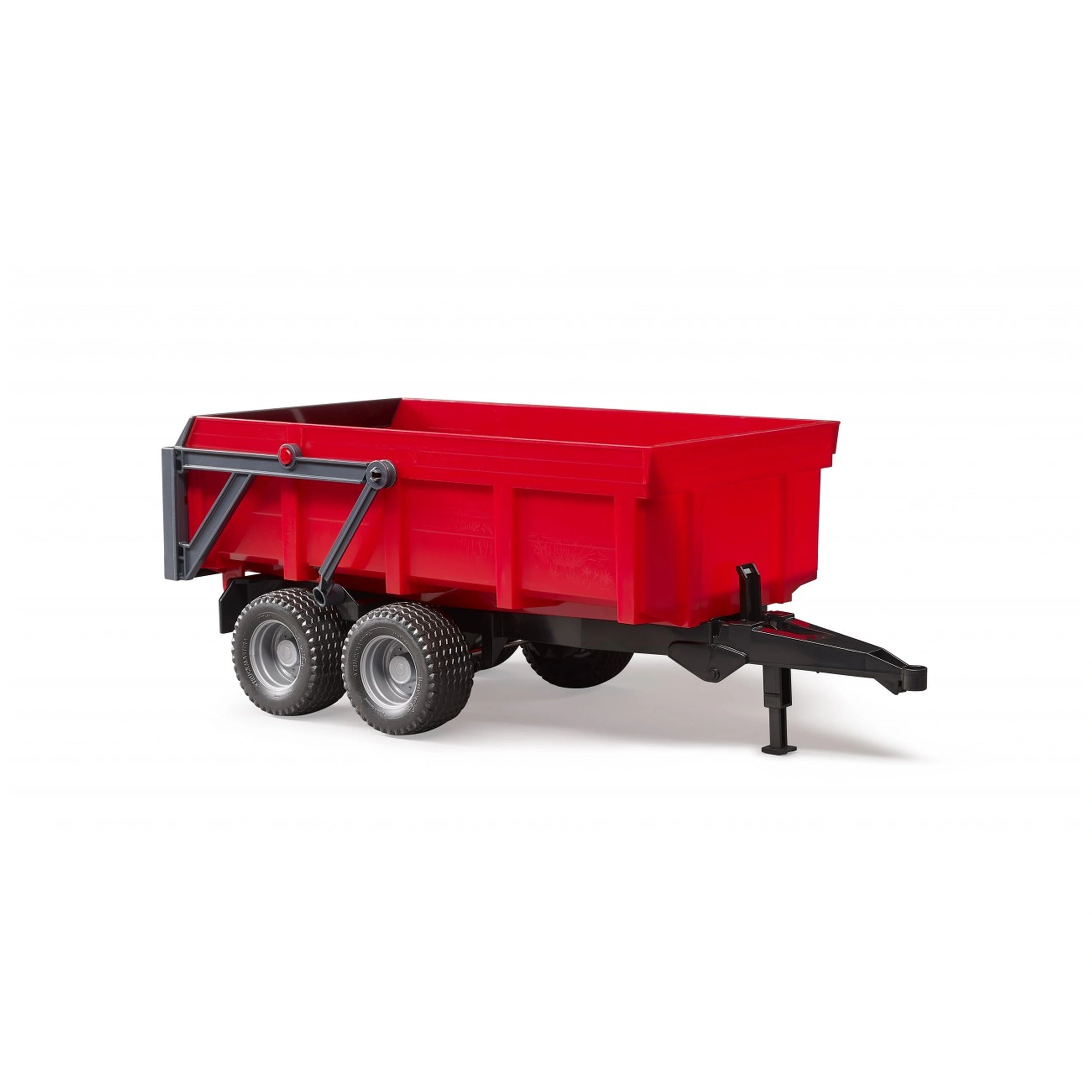 Red Bruder tipping trailer with double axle and automatic tailgate, designed for imaginative play with Bruder tractors.
