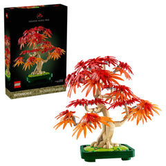 LEGO Botanicals Japanese Red Maple Bonsai Tree set with vibrant red and orange leaves, displayed on a green base with the box in the background.