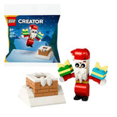 LEGO Christmas Chimney Fun with Santa set features a cheerful Santa figure holding two gifts. The set includes a snow-covered chimney backdrop, perfect for holiday decorations.