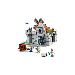 A detailed LEGO Creator 3in1 Medieval Horse Knight Castle with a windmill, featuring knights and villagers, a cart of treasures, and a castle entrance.