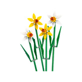 Four LEGO flowers stand tall, featuring two vibrant yellow daffodils and two elegant white daffodils, with lush green stems and adjustable leaves, set against a bright white background.
