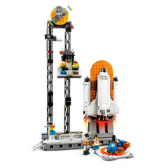 Colorful LEGO® Creator 3in1 Space Roller Coaster set featuring a rocket, various celestial elements, and five minifigures in a space-themed amusement park.