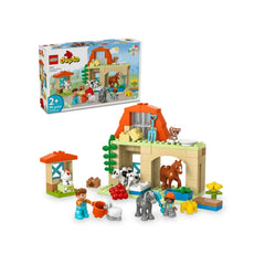 LEGO® DUPLO® Caring for Animals at the Farm set featuring a colorful barn, farm animals, and two play figures engaged in animal care activities.