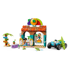 Colorful LEGO® Friends Beach Smoothie Stand set with two mini-dolls, a smoothie stand, beach buggy, and a turtle.