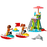 Two mini-dolls in life vests ride colorful water scooters near a vibrant lifeguard tower, accompanied by a playful dolphin.