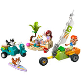 LEGO Friends construction set featuring two minidolls, a corgi on a surfboard, and a scooter with a playful beach scene.
