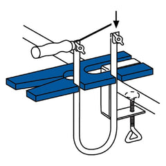 Fretsaw frame assembly diagram with blue cutting table and adjustable clamp.