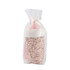 Floral-patterned bottle holder in sheer white fabric tied with a ribbon, part of the ASI Dolls Martina Collection.