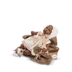 Lara Reborn doll, 46 cm, in floral dress with bonnet, lying on brown blanket, detailed lifelike features.