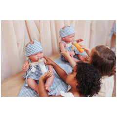 ASI Dolls - Maria Collection Set Noel with Crown featuring three baby dolls in matching outfits being lovingly fed by a child