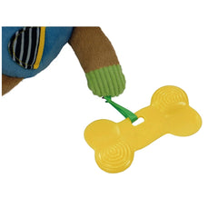 Pete The Puppy stuffed animal's brown paw in a green sock holds a yellow bone-shaped toy in a close-up view.