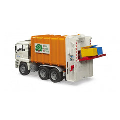 Bruder MAN TGA garbage truck toy with orange body, rear loader, and recycle bins attached.