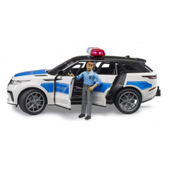 Bruder Range Rover Velar Police toy with officer figure, blue and white design, open doors, red light on top.