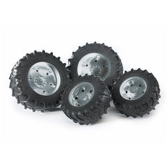 Twin black rubber tyres with silver hubs, designed for Bruder 3000 Series play vehicles, showing robust tread pattern.