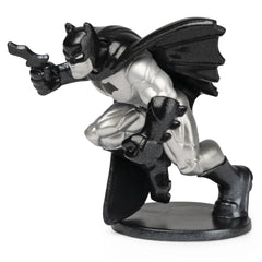 DC Comics BATMAN collectible mini figure stands in a dynamic pose, featuring a glossy black finish and a cape.