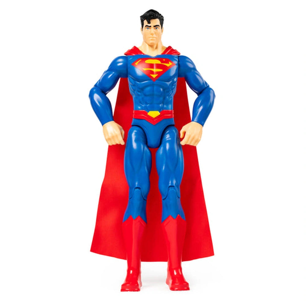 Superman action figure stands confidently in blue and red attire with a detailed face and muscular build against a white back