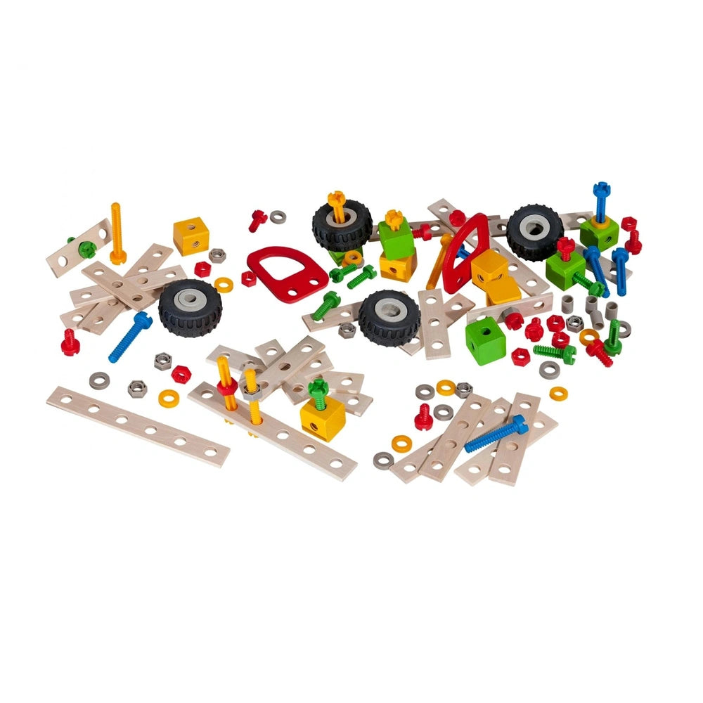 Eichhorn construction set features 111 colorful plastic parts including wheels, axles, and connectors scattered on a white ba