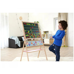 Eichhorn Magnetic Drawing Board with a child engaged in learning the alphabet next to a colorful easel in a cozy playroom.