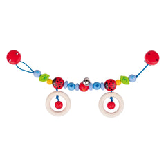 GOKI pram chain features colorful plastic beads in red, blue, green, and yellow, strung together on a long white plastic stri
