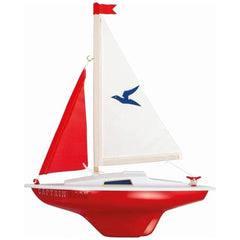 Gunther Flugspiele Captain Hook sailing boat with a glossy red sail, white hull, and blue logo, perfect for outdoor play.