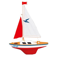 Giggi Sailing Boat Ready-To-Sail features a red fabric sail and a colorful plastic base with blue, white, black, and yellow s