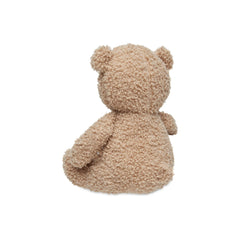 Light brown Jollein teddy bear made of soft, fuzzy material with visible stitching and seam on its torso.