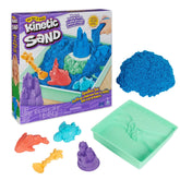 Kinetic Sand Sandbox Set features blue sand, a green tray, and assorted orange and green plastic components for creative play