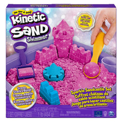 Kinetic Sand Shimmer Sparkle Sandcastle Set in a purple box with pink sand, plastic shovel, molds, rake, and sifter inside.