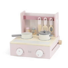 Foldable cooker toy in light pink with white and gray knobs, spools, and handles, featuring a lid and drawer.