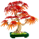 LEGO Botanicals Japanese Red Maple Bonsai Tree featuring vibrant red and orange leaves, intricately designed, set in a dark green pot.