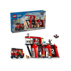 LEGO City Fire Station set with fire truck, featuring a red building with two garages, five firefighter mini figures, and a drone.