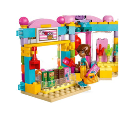 Colorful LEGO® Friends Heartlake City Candy Store set featuring a mini-doll holding candy, with candy shelves and playful decorations.