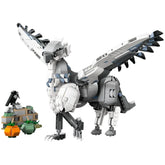 LEGO Harry Potter Buckbeak construction set featuring a large, posable Hippogriff in shades of gray and white, alongside a small buildable section with pumpkins.