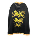 Black glossy King Cape with yellow lion emblem on chest, featuring collar, hood, front opening, and waist belt.