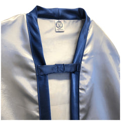 Liontouch Mystery Knight Cape in metallic blue satin, featuring multiple blue straps and closures, displayed on a mannequin.