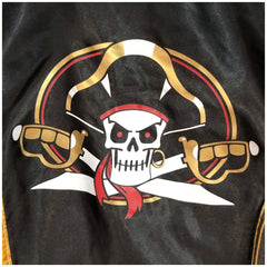 Liontouch Pirate Cape features a skull with crossed swords, red bandana, and gold accents on a black background.