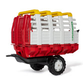 Rollyhay Wagon Pottinger Trailer features a red and white cart with a black wheel, yellow handles, and "POTTINGER" text.
