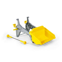 Yellow plastic construction toy bulldozer accessory lies on its side, featuring gray components and a wheel axle.