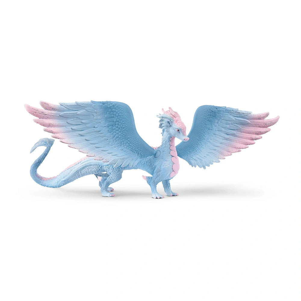 Crystal dragon figure in blue and pink, standing upright with spread wings against a plain white background.