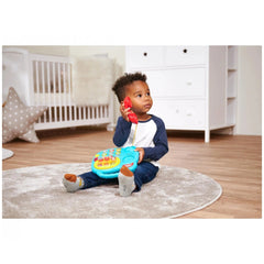 Simba ABC Colorful Telephone in a childs room with a young child playing with it on a gray rug.