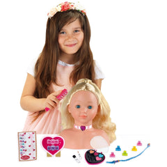 Theo Klein Make-Up and Hairstyling Head features a doll with blonde hair, pink collar, and purple bow, held by a girl in a wh