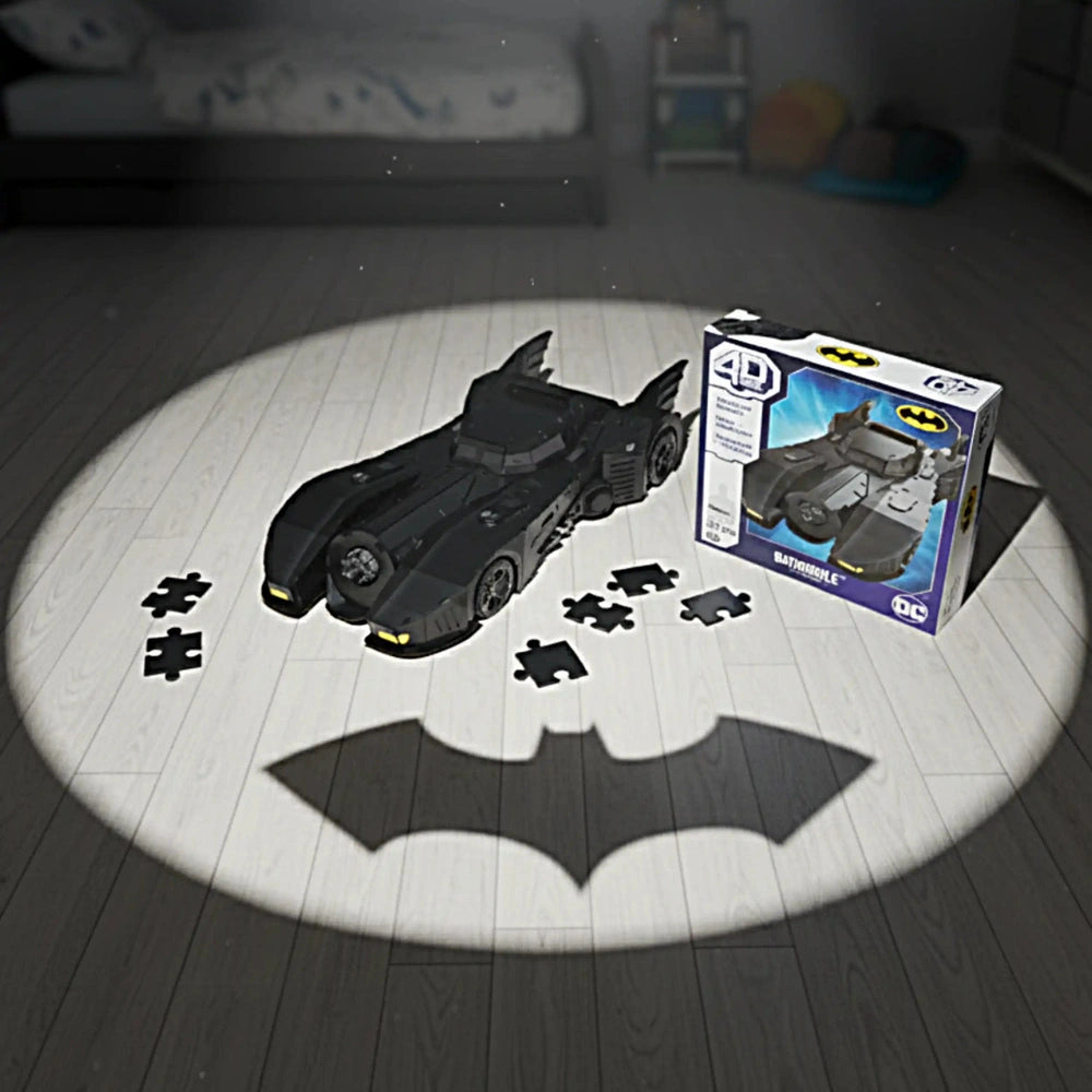 4D Build DC Batman Retro Batmobile 3D Puzzle Model Kit is a black, glossy toy car with bat-like design on a wooden floor.