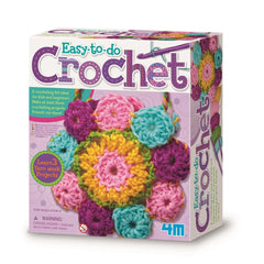 4M Crochet Art kit packaging features a glossy white cardboard, multi-colored crochet flower pattern, and crochet hook.