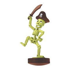 4M KidzLabs Dig Glow Pirate toy playset features a green skeleton, black pirate hat, white skull, and brown sword on a brown 
