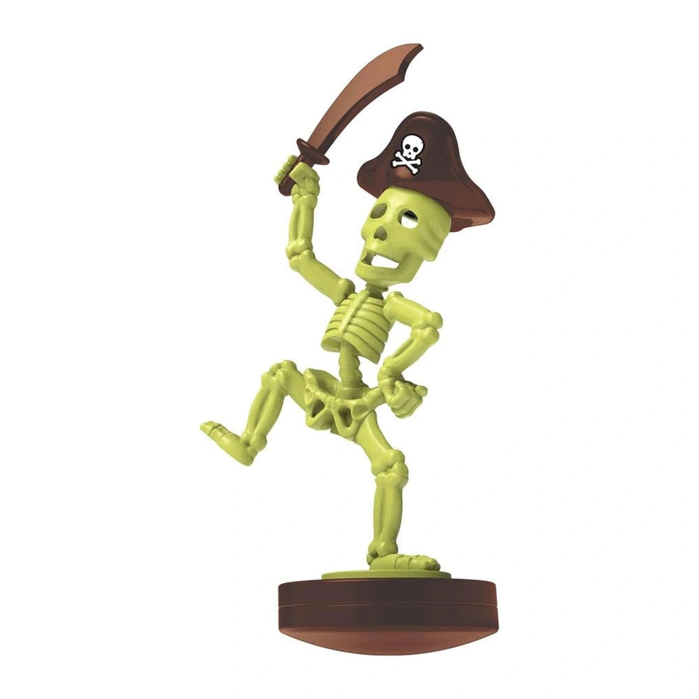 KidzLabs Dig Glow Pirate toy playset featuring a green skull, brown pirate hat, and brown sword arranged centrally.